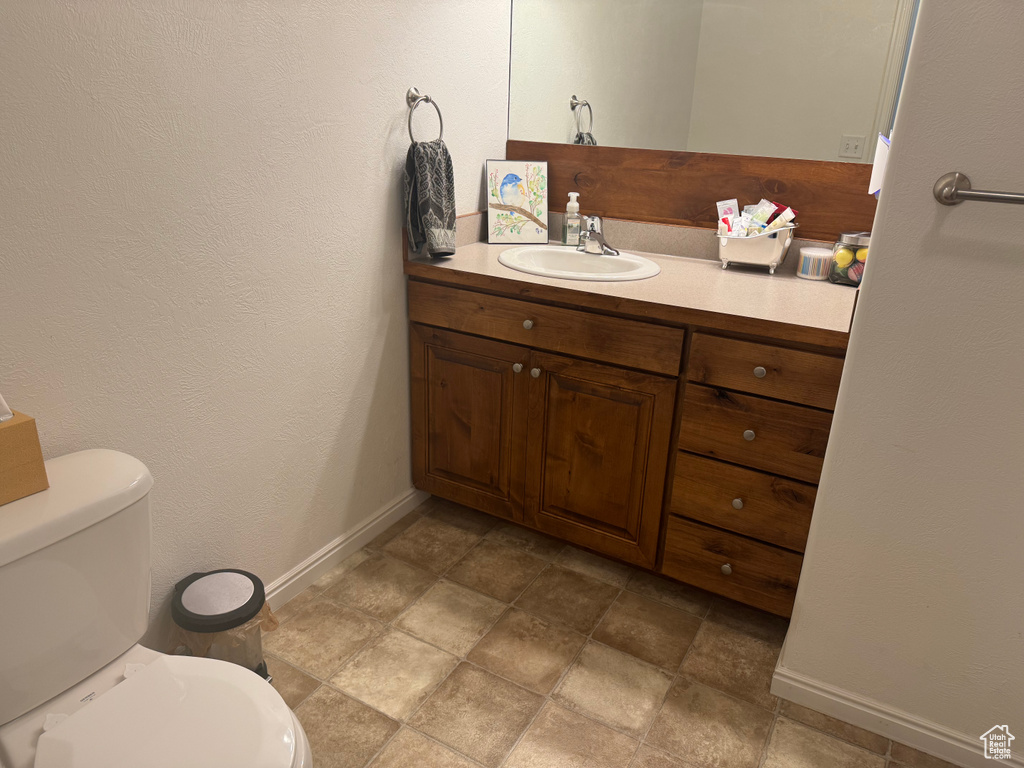 Bathroom featuring vanity and toilet
