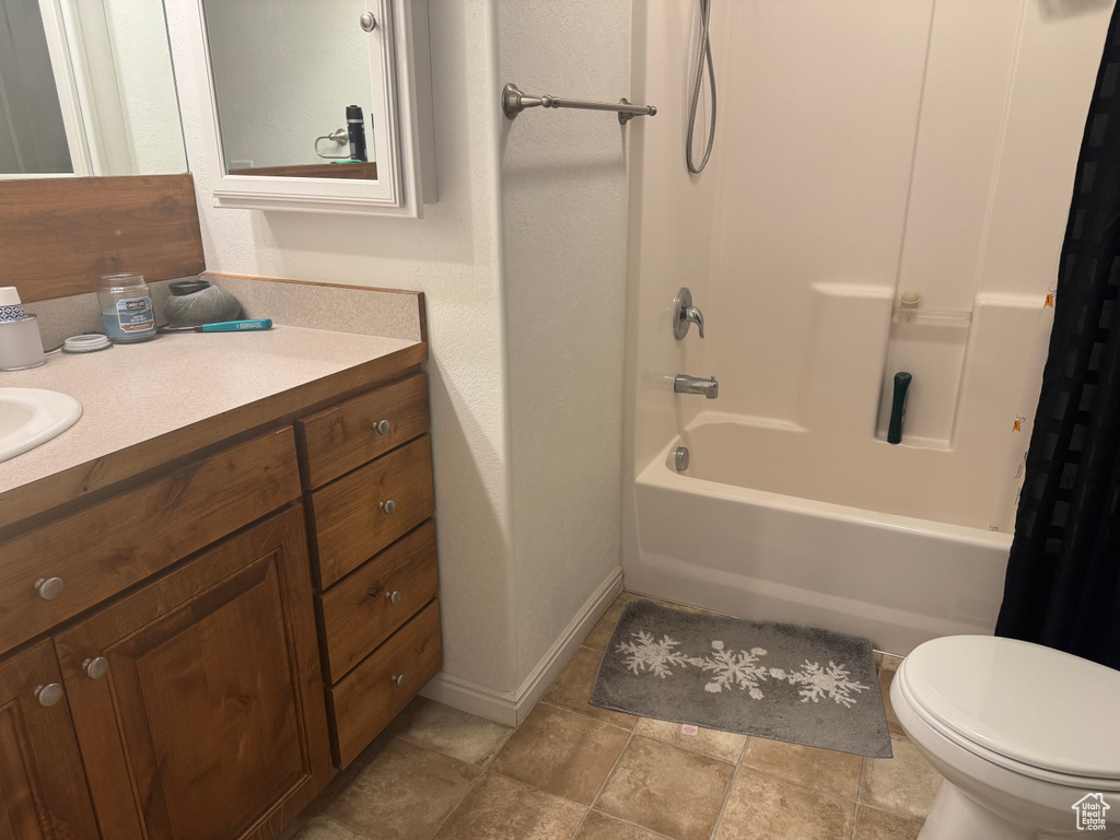 Bathroom featuring vanity and shower / tub combo