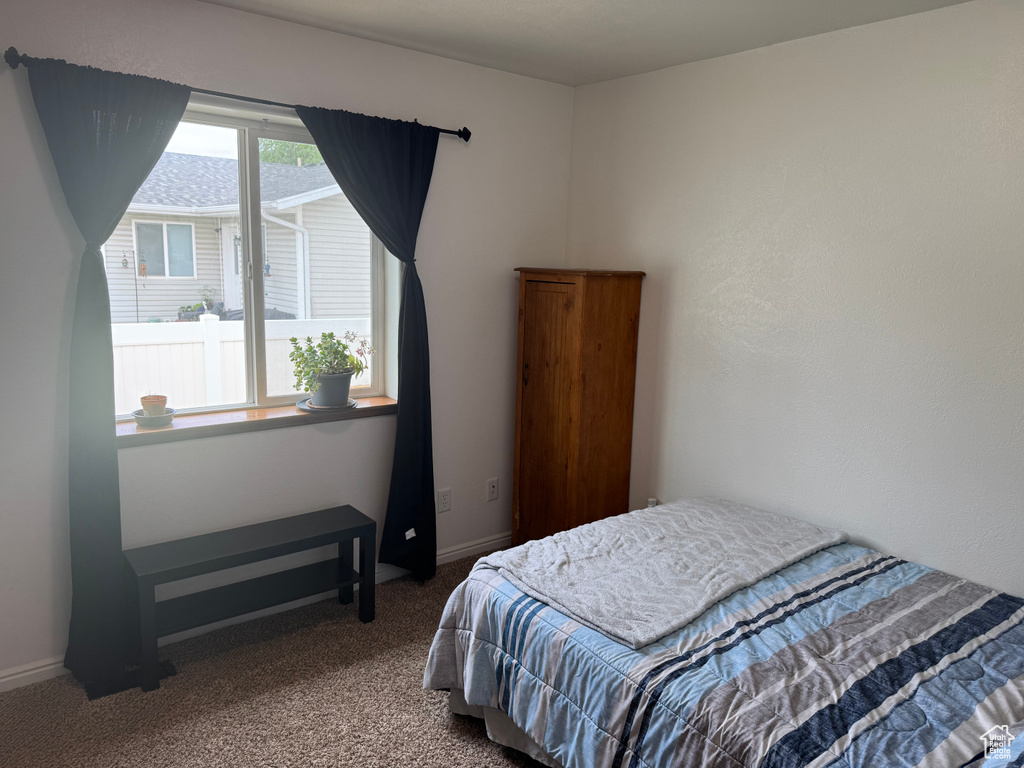 Bedroom featuring carpet