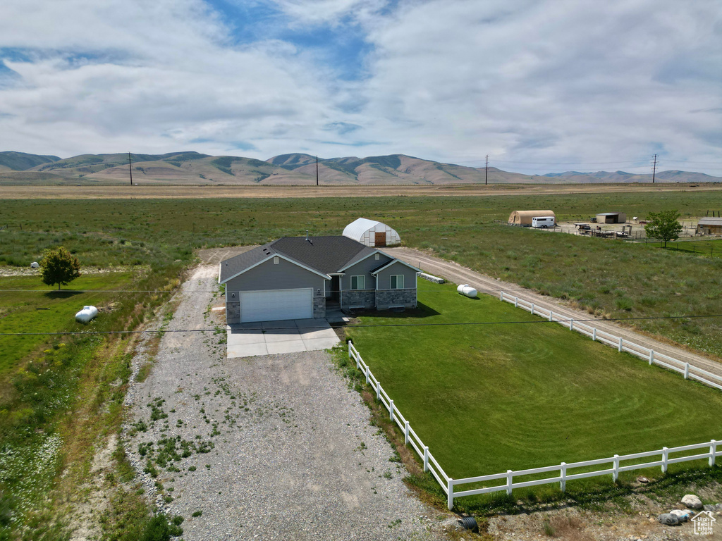 Aerial view of sparsely populated area with a mountain backdrop