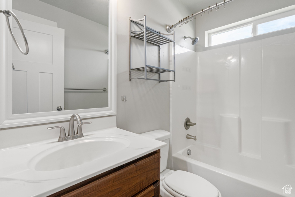 Full bath featuring shower / bathtub combination and vanity