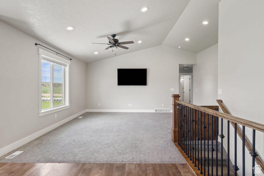 Unfurnished room with vaulted ceiling, a ceiling fan, recessed lighting, and wood finished floors