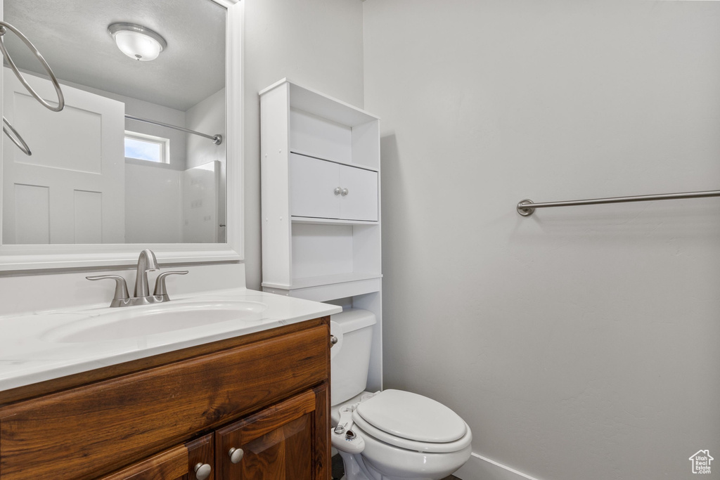 Bathroom featuring vanity and a shower