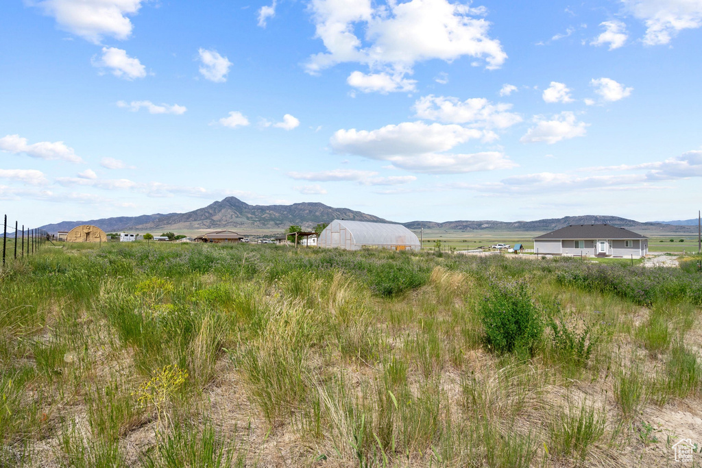 View of mountain background featuring rural landscape