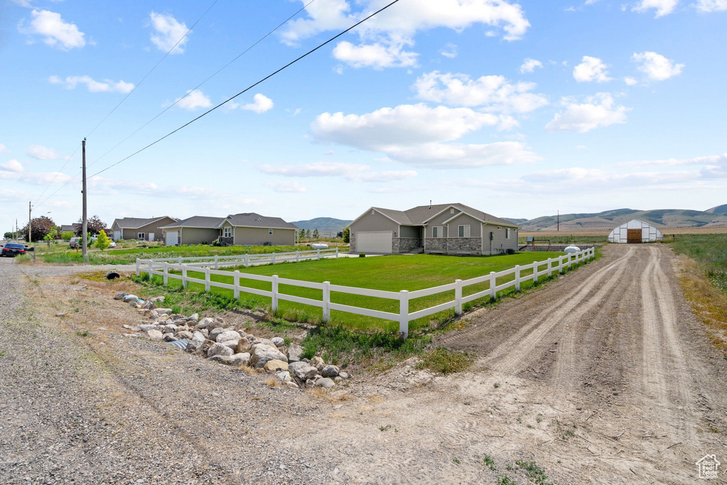 View of dirt / gravel road featuring a rural view