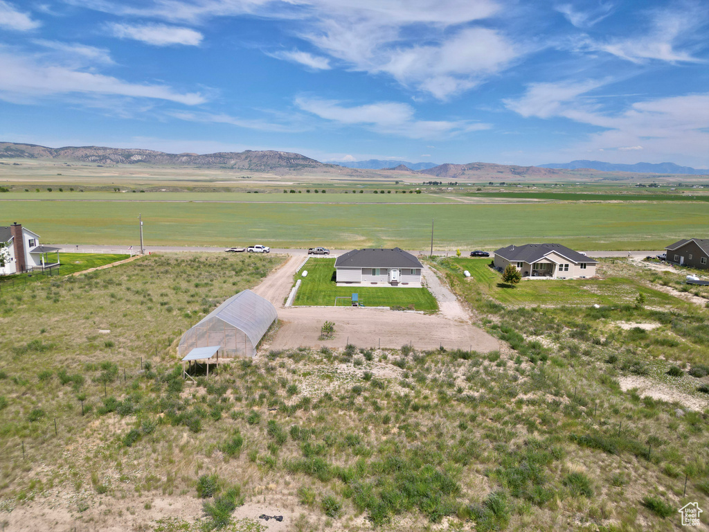 Aerial view of sparsely populated area with a mountain backdrop