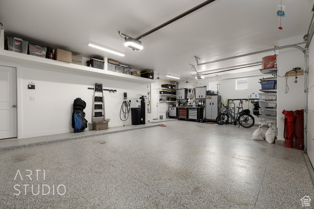 Garage featuring a garage door opener