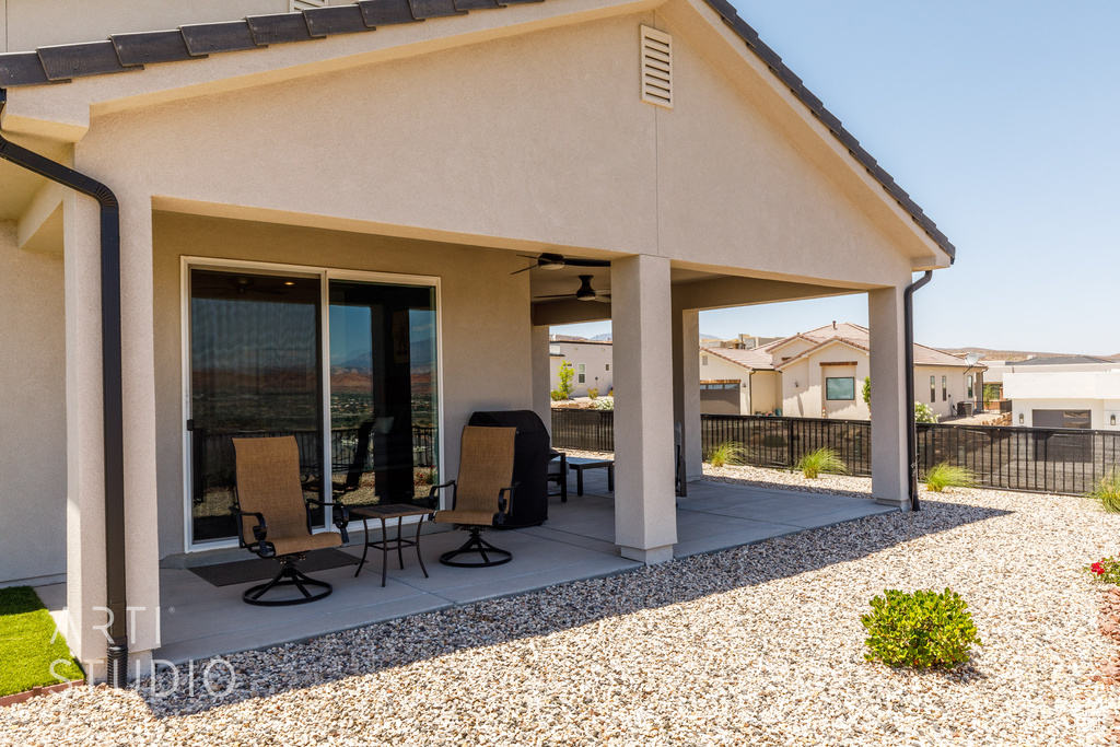 View of patio / terrace featuring a residential view and a ceiling fan