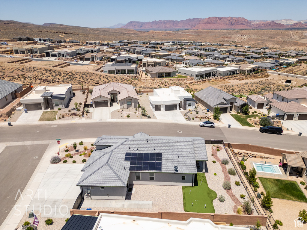 Aerial view of residential area with a mountainous background