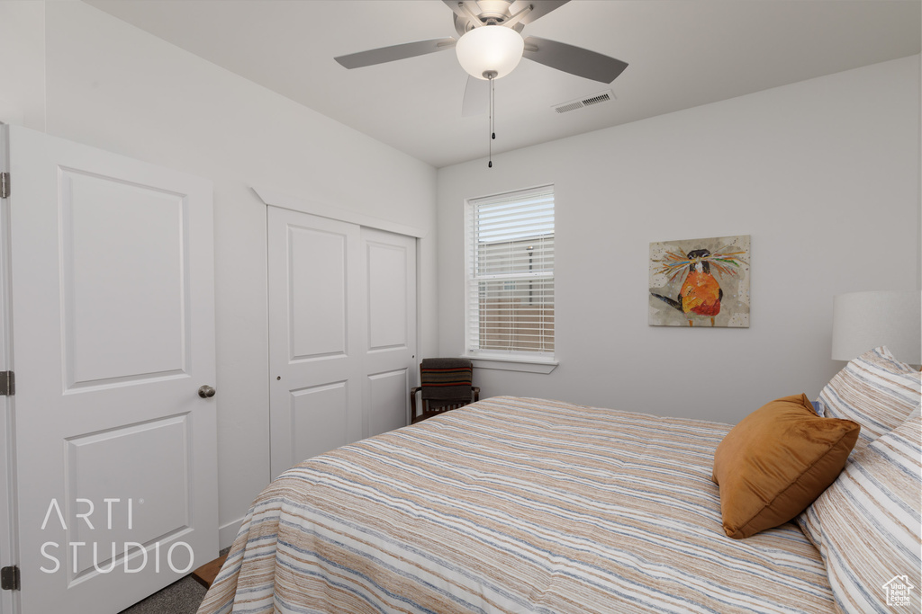 Bedroom with a closet and ceiling fan