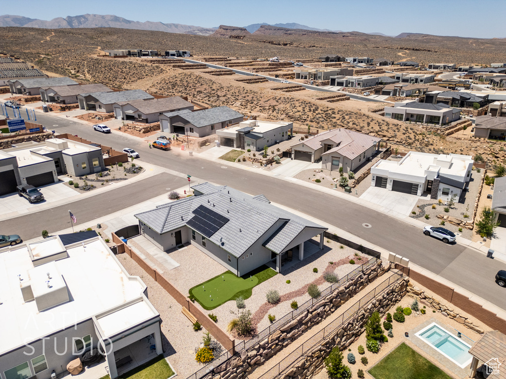 Aerial perspective of suburban area with a mountain backdrop