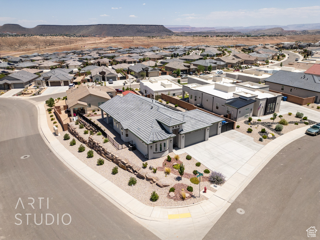 Aerial view of residential area featuring a mountain backdrop