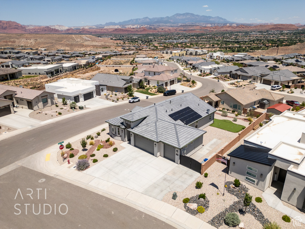 Aerial perspective of suburban area with a mountainous background