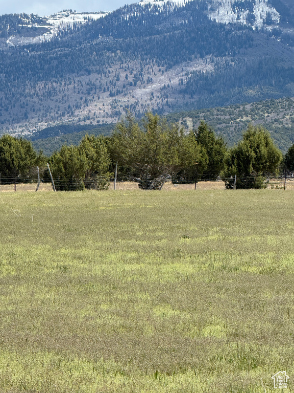 View of mountain backdrop featuring rural landscape