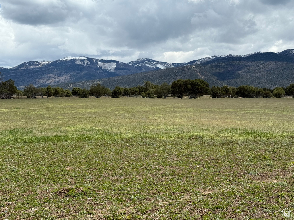View of mountain backdrop featuring rural landscape