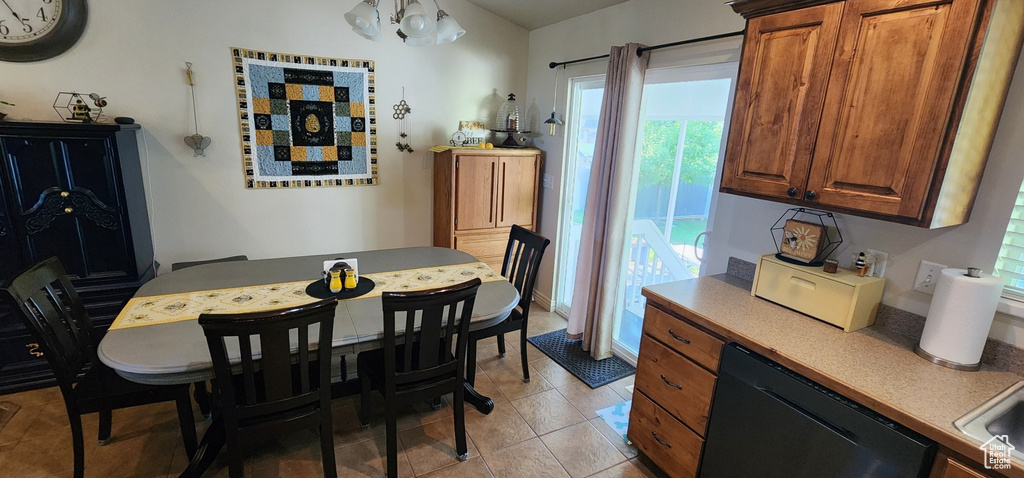 Dining area with light tile patterned floors