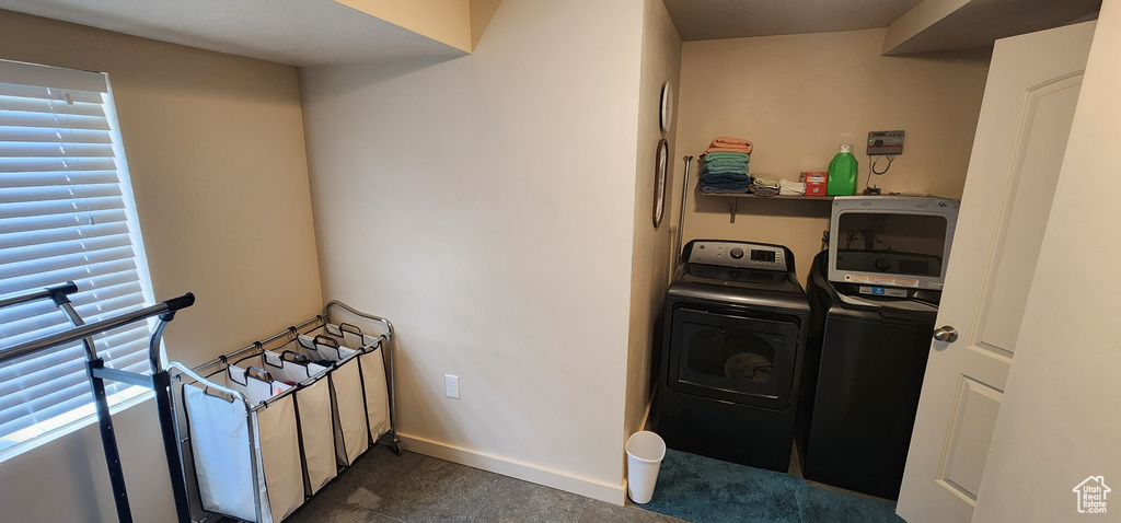 Laundry area with washer and dryer and healthy amount of natural light