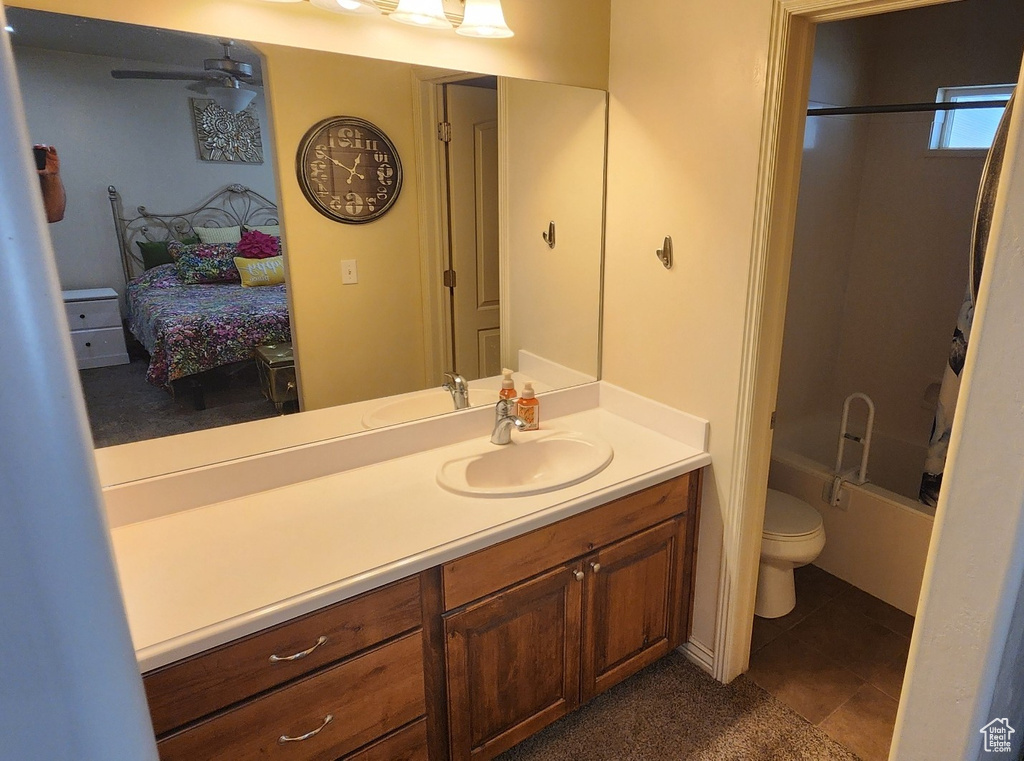 Full bath featuring connected bathroom, vanity, tile patterned floors, and shower / tub combination