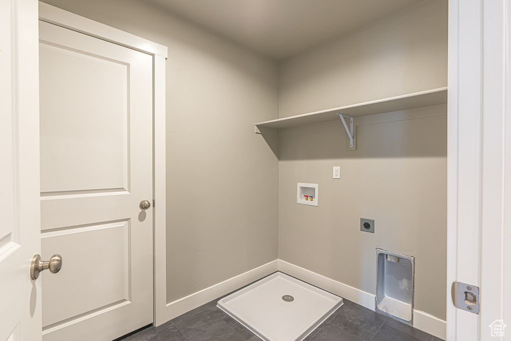 Washroom featuring hookup for an electric dryer and hookup for a washing machine