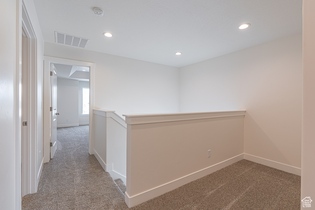 Hall with carpet and recessed lighting