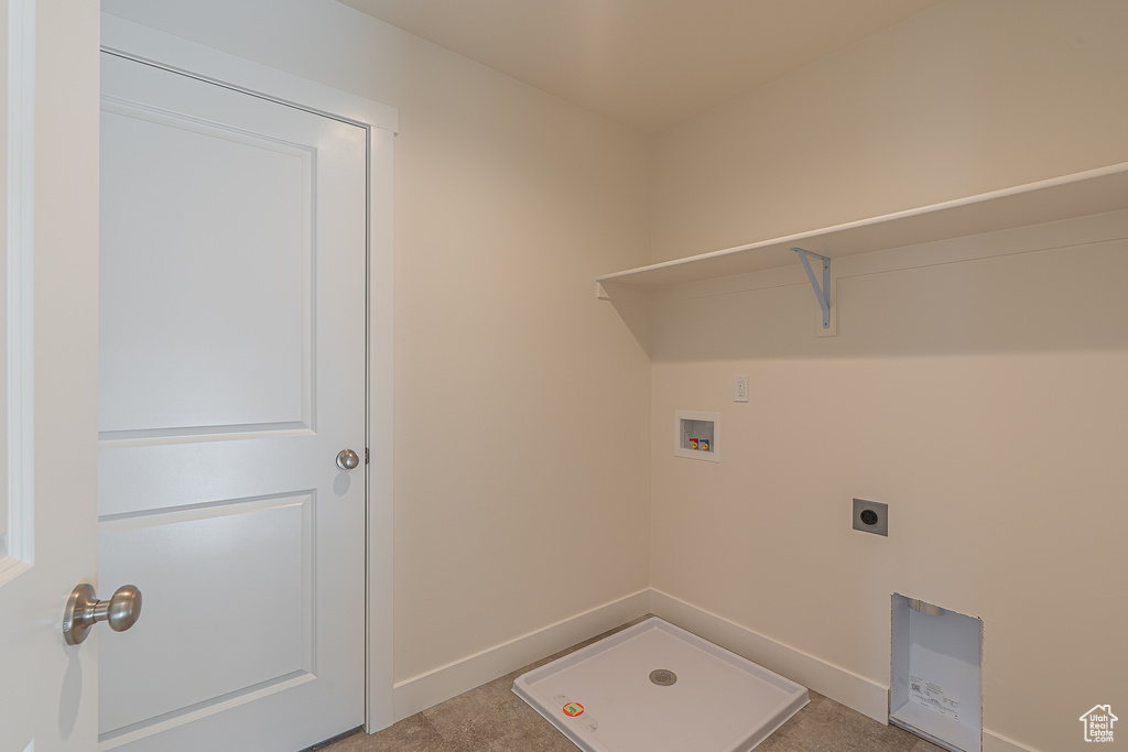 Laundry room with hookup for a washing machine and hookup for an electric dryer