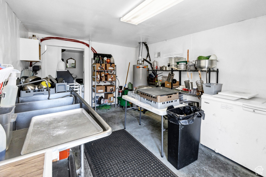Garage featuring water heater