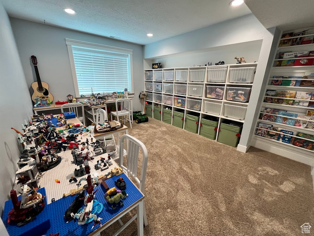 Carpeted home office featuring recessed lighting