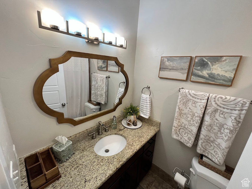 Bathroom with toilet and vanity