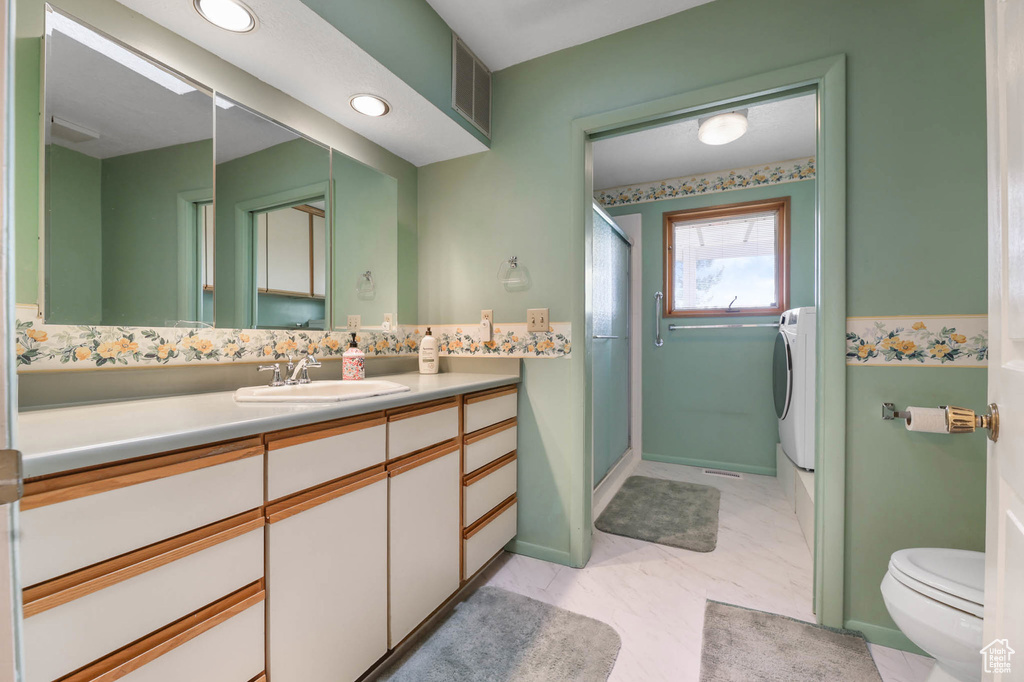 Full bath featuring a shower stall, vanity, and recessed lighting