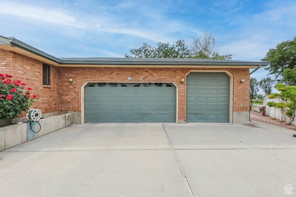 Garage featuring driveway