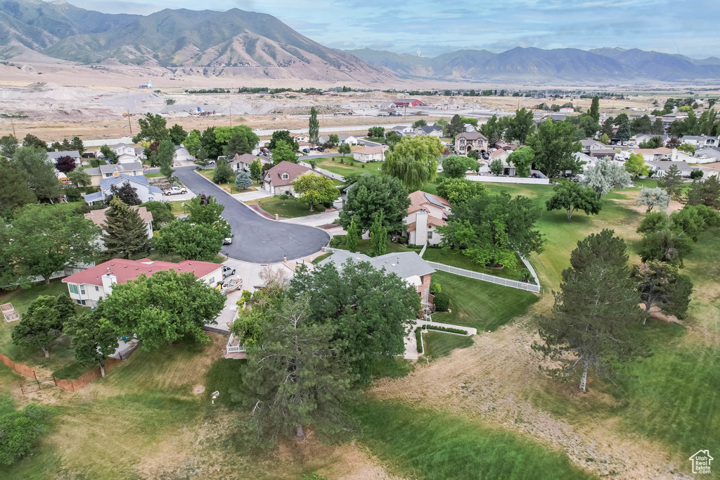 Aerial overview of property's location featuring nearby suburban area and mountains