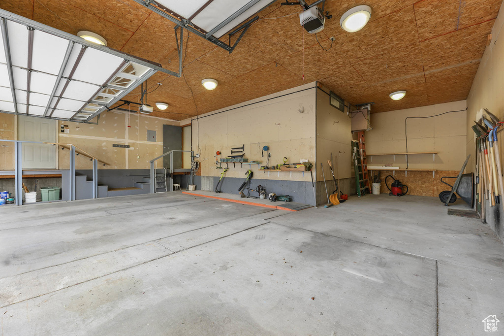 Garage featuring a garage door opener