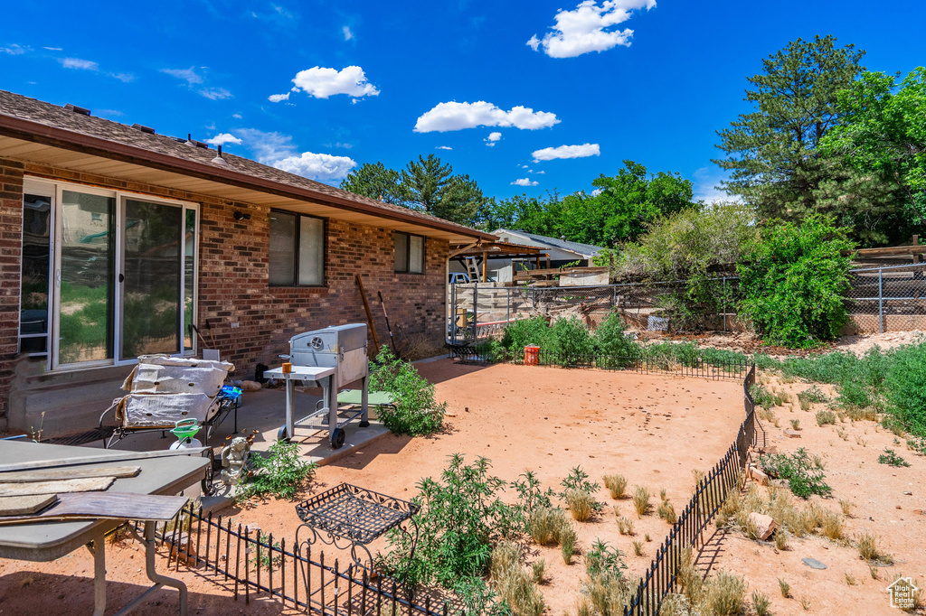 Fenced backyard featuring a patio area