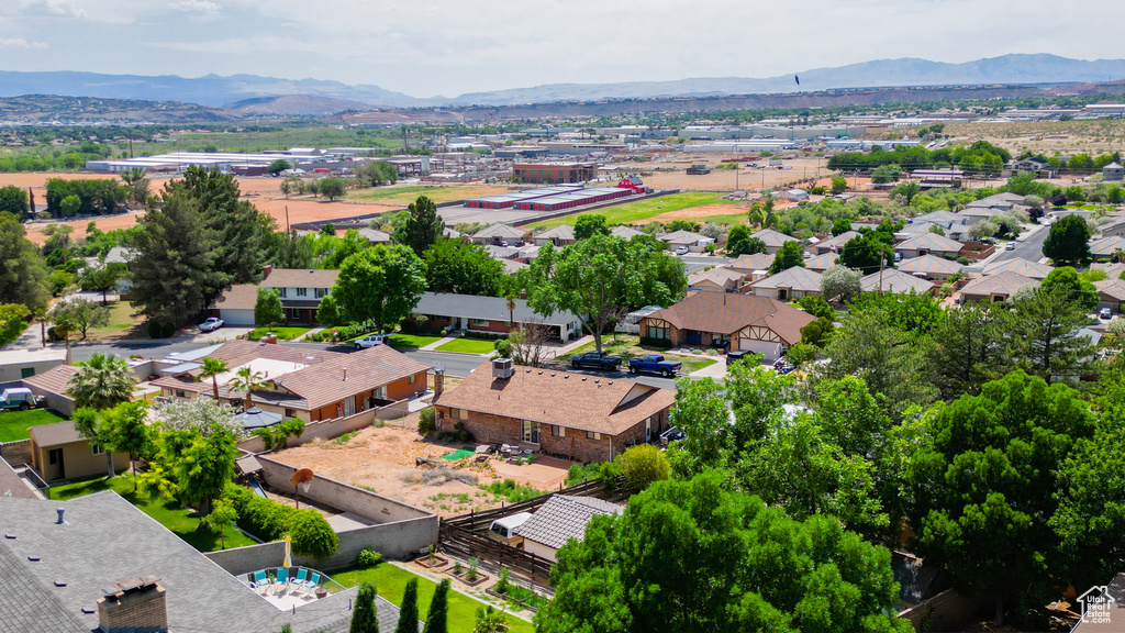 Aerial view of residential area featuring mountains