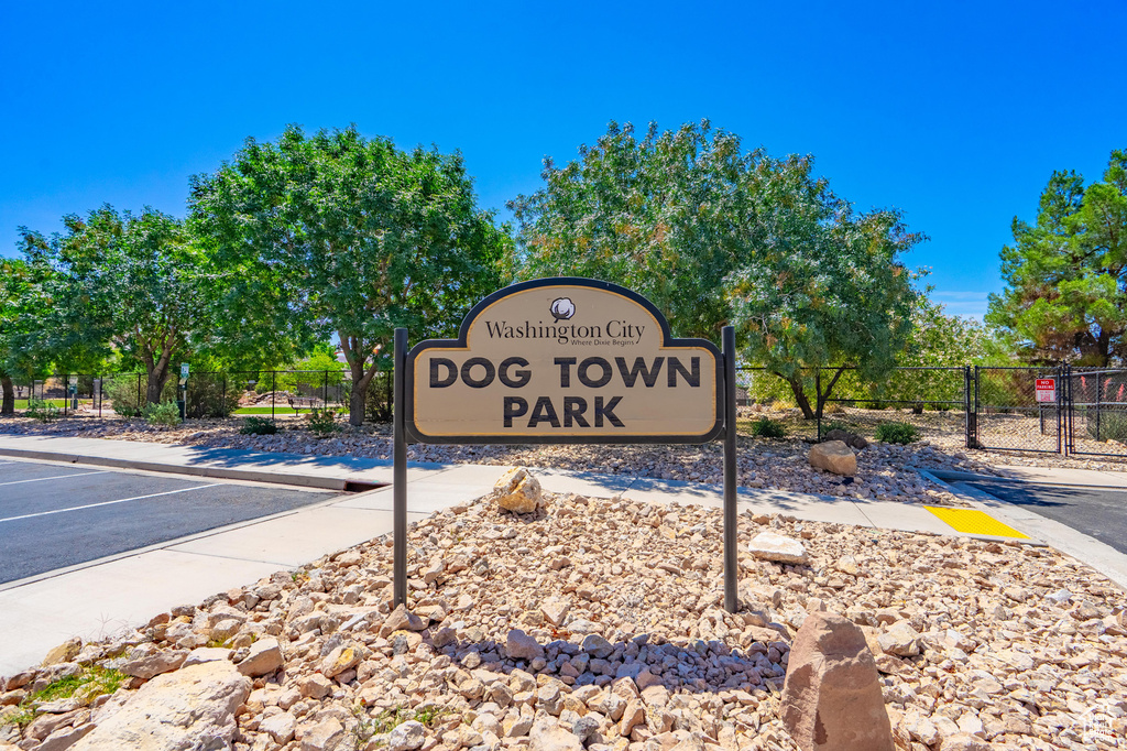 Community sign featuring uncovered parking