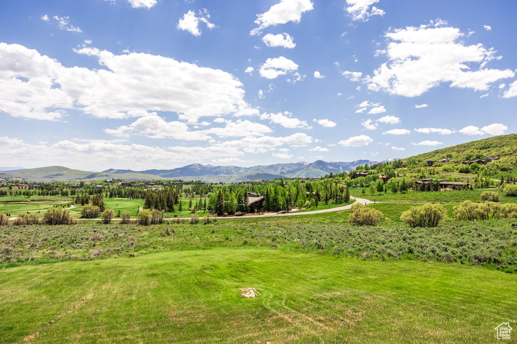 View of mountain backdrop featuring rural landscape