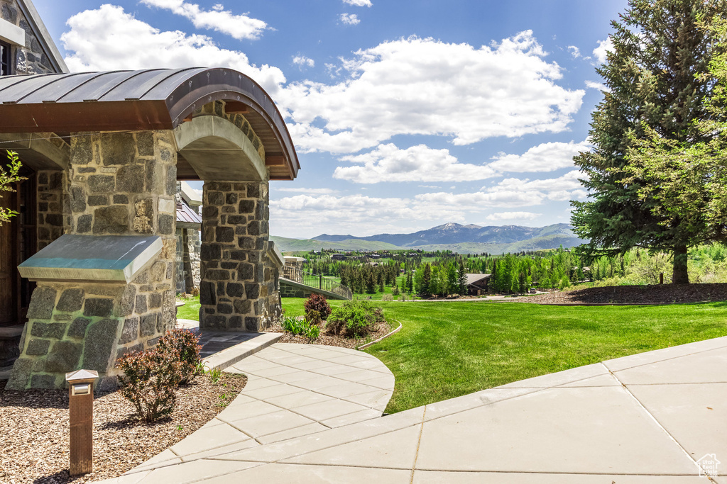 View of green lawn with a mountain view