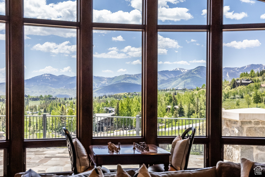 Dining area with a mountain view and healthy amount of natural light