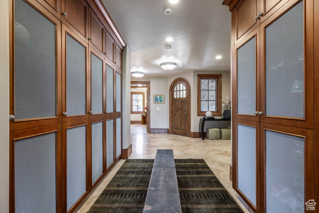 Entryway with recessed lighting and baseboards