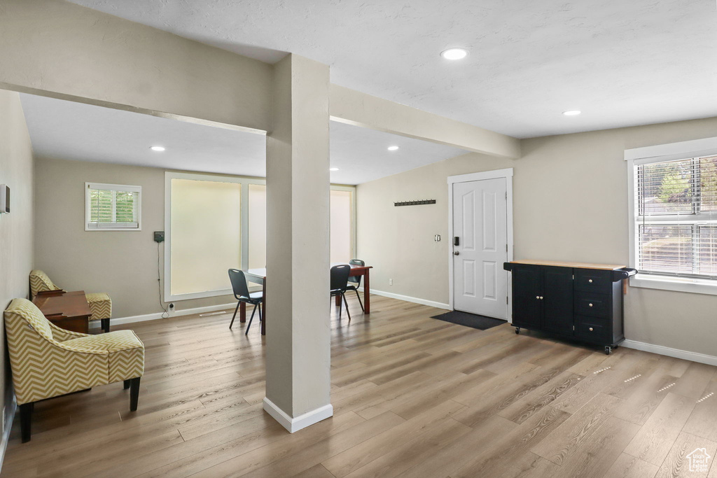 Interior space with light wood-type flooring and recessed lighting