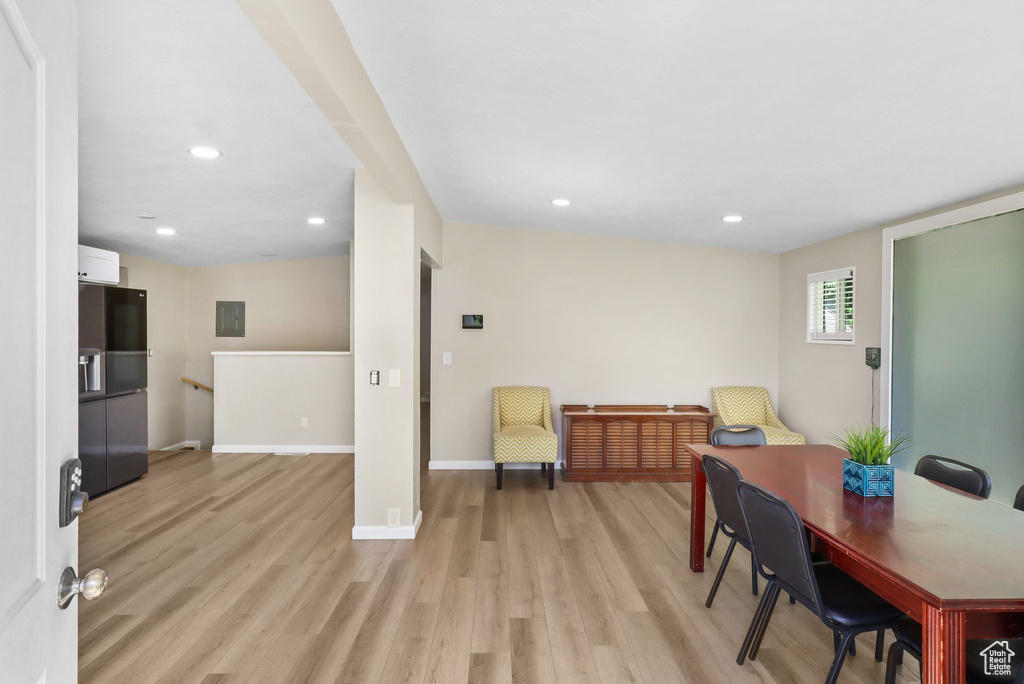 Office area with light wood-type flooring, recessed lighting, and electric panel