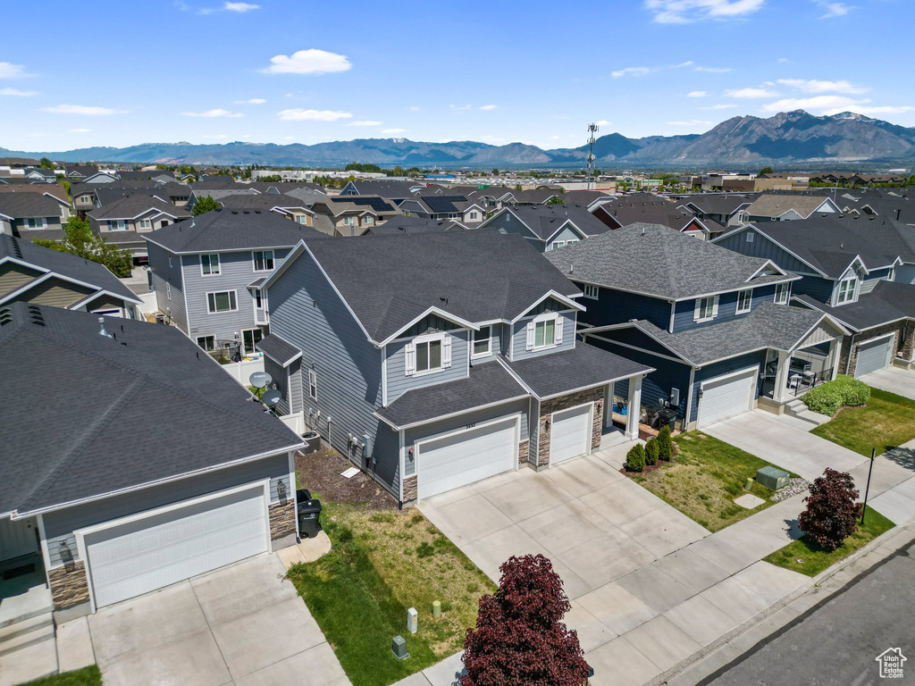 Aerial perspective of suburban area featuring a mountainous background