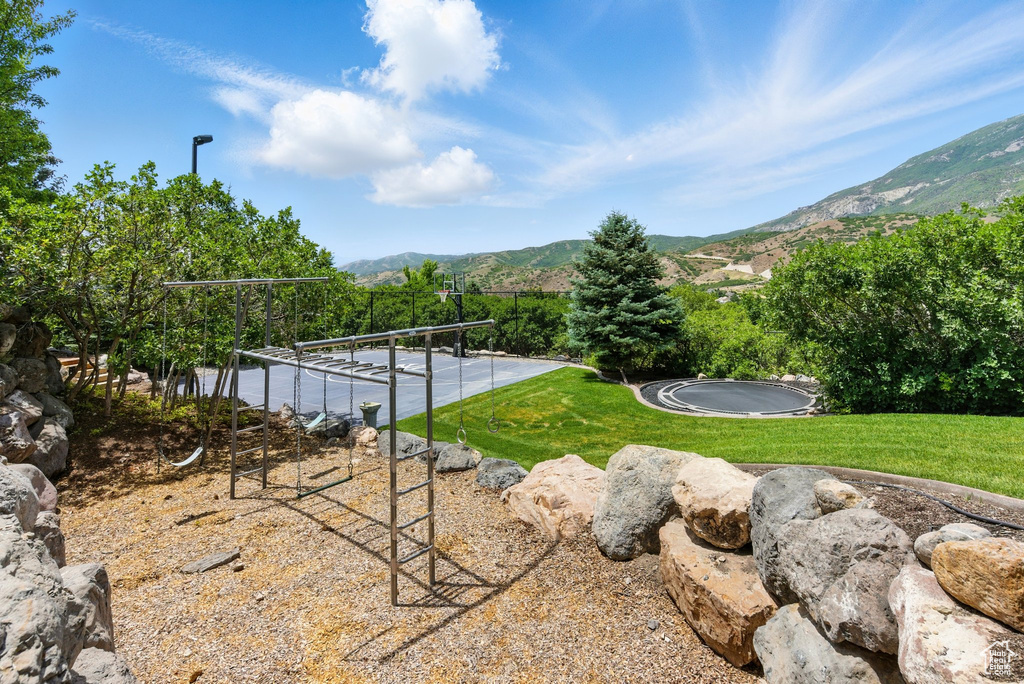 View of grassy yard featuring a mountain view
