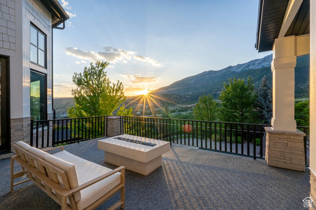Patio / terrace featuring a mountain view and a fire pit
