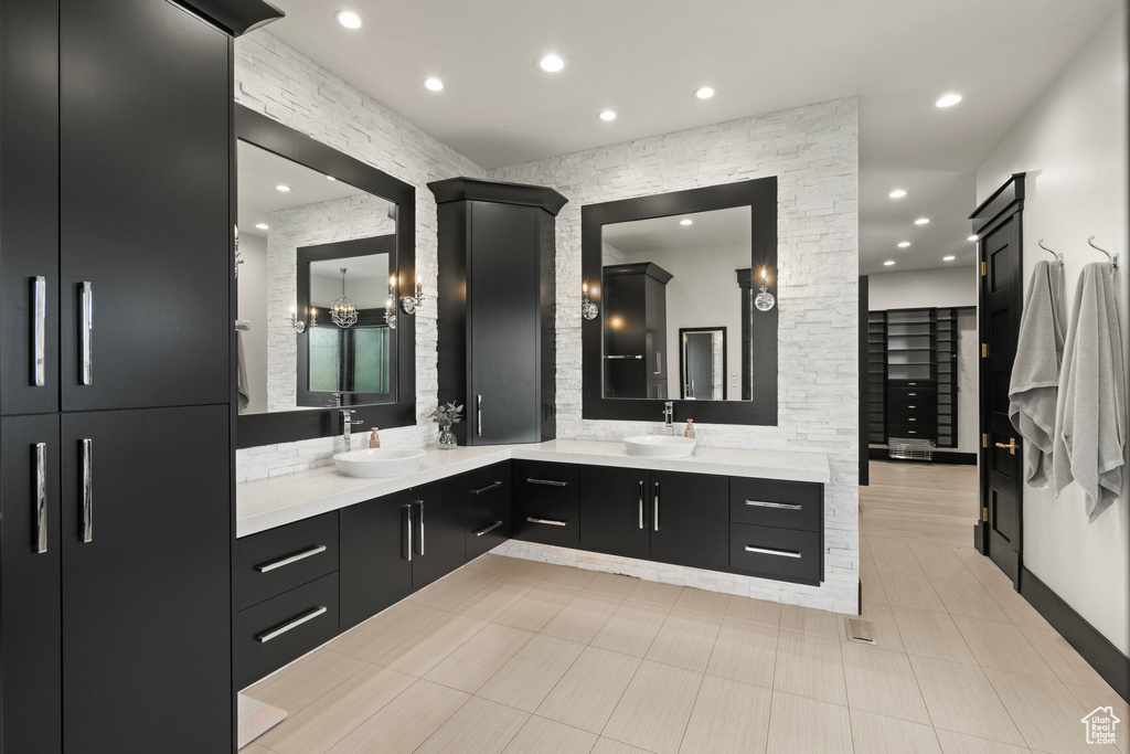 Full bath featuring double vanity and recessed lighting