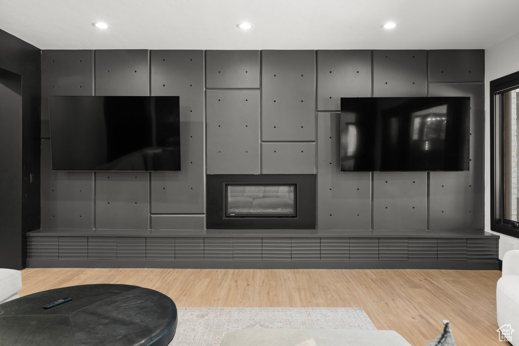 Living room with wood finished floors and recessed lighting