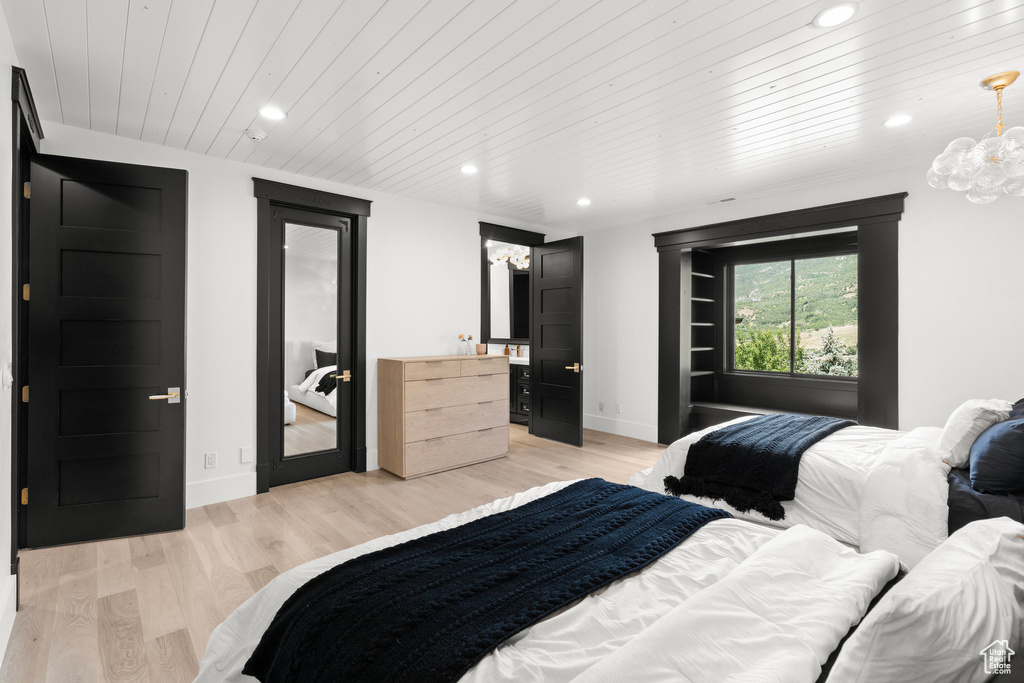Bedroom with recessed lighting, wood ceiling, light wood-type flooring, a chandelier, and access to exterior