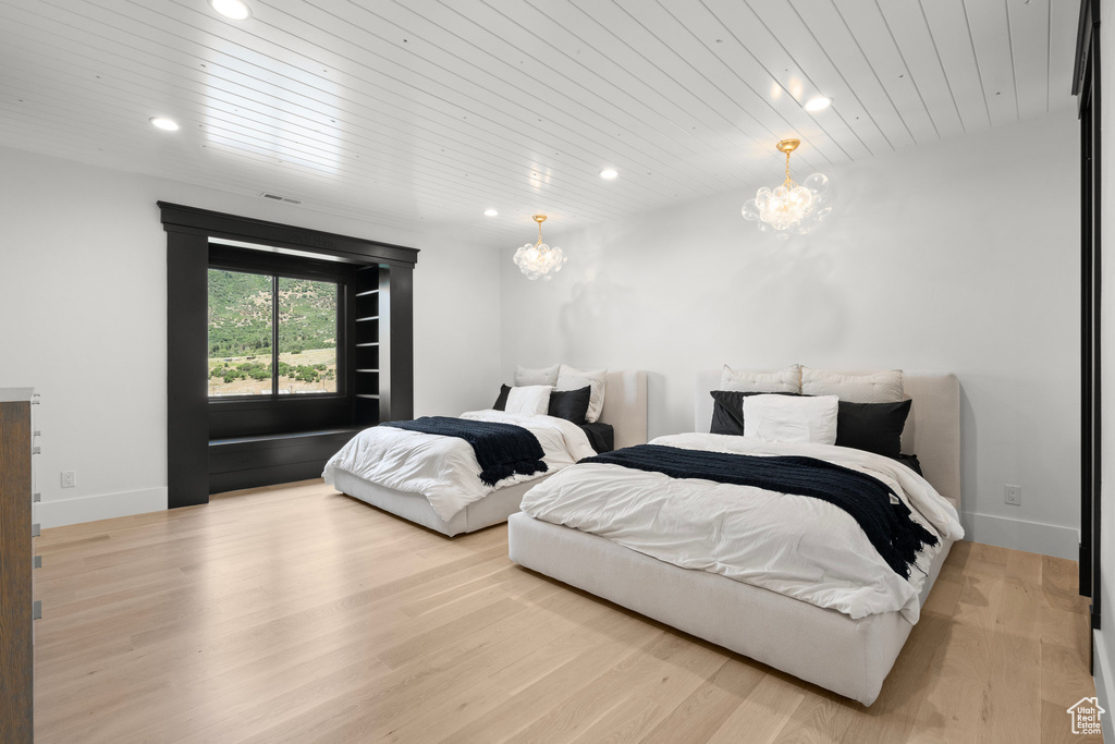 Bedroom featuring a chandelier, recessed lighting, wood finished floors, and wooden ceiling
