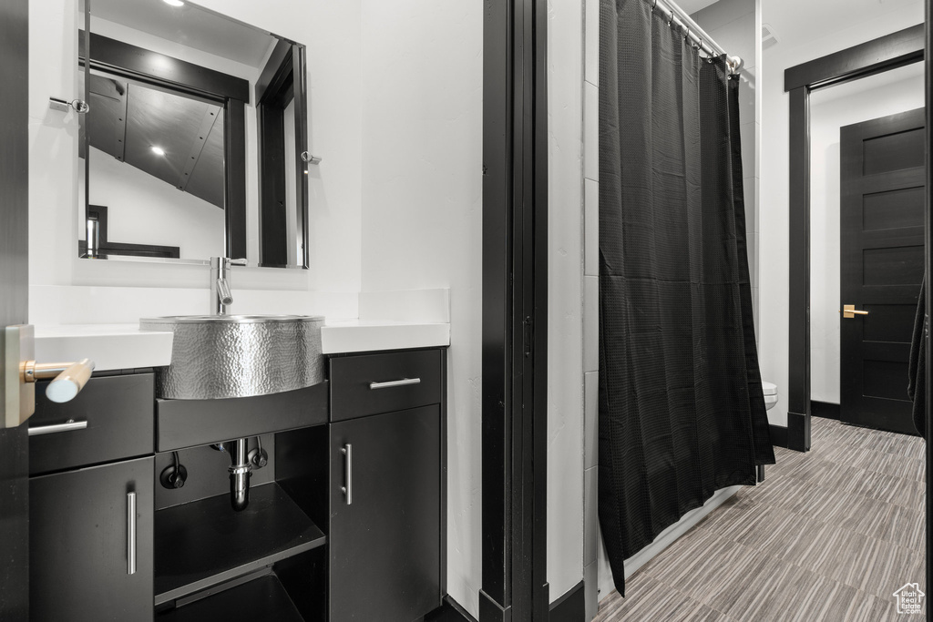 Bathroom with vanity and a shower with shower curtain