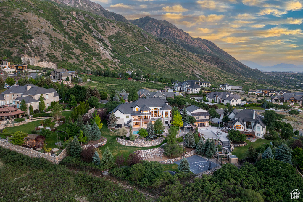 View of property location with a mountain backdrop and nearby suburban area